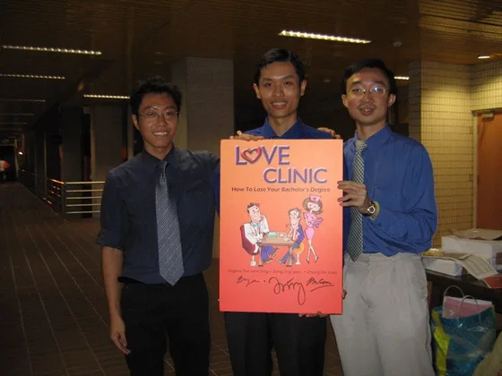 The Love Doctors with a Love Clinic poster at the NUS seminar